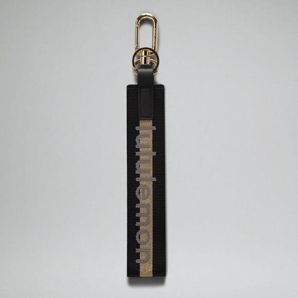 NEW Lululemon Never lost Keychain Wordmark Black and Gold - Picture 2 of 9